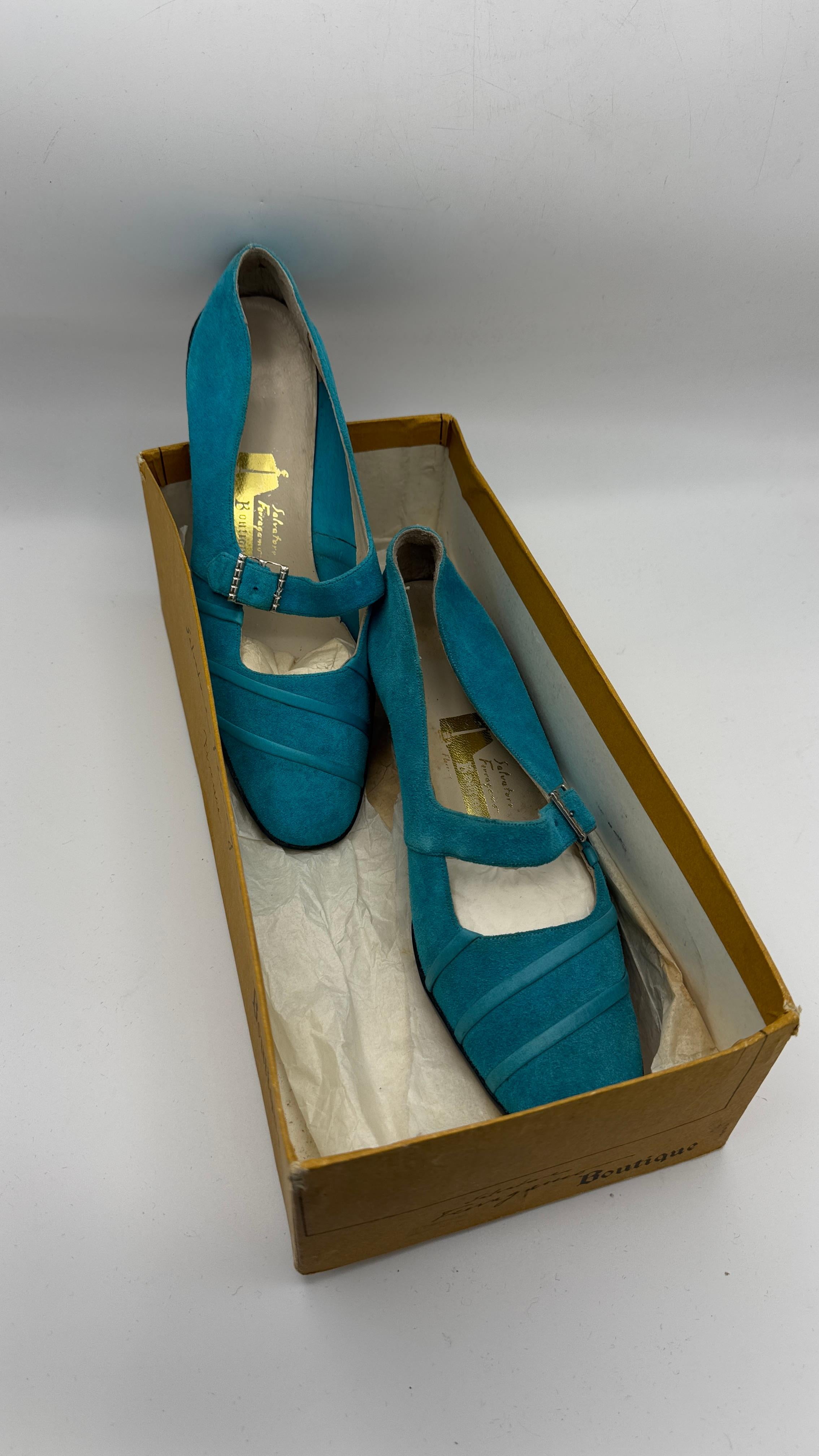 Step into history with this stunning and rare pair of Salvatore Ferragamo Boutique Mary Jane heels, dating from the late 1950s to early 1970s. Crafted in vibrant turquoise-blue suede, they feature elegant diagonal stitching and a square toe design