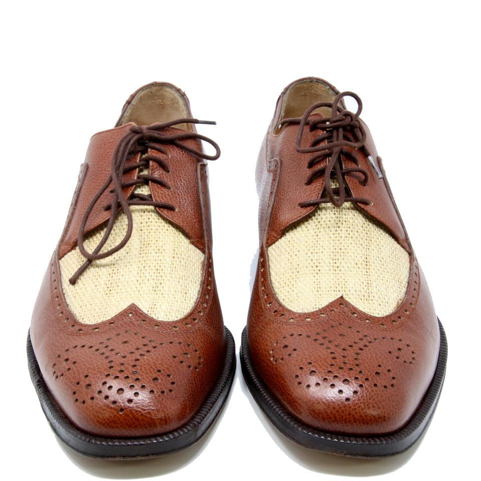 Salvatore Ferragamo Brown 2-Material Burlap Wingtip Leather Oxford Lace Up Dress Shoes

A pair of Salvatore Ferragamo shoes are the holy grail of men's footwear, legitimating you to combine them with almost anything. However, even being well-known
