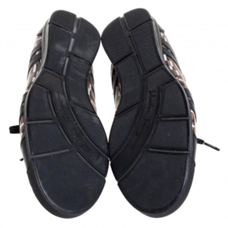 Fashioned to take your style a notch higher, these low-top sneakers from Salvatore Ferragamo are absolutely worth the splurge! They've been crafted from signature canvas and detailed with black leather. These trainers are finished off with laces on