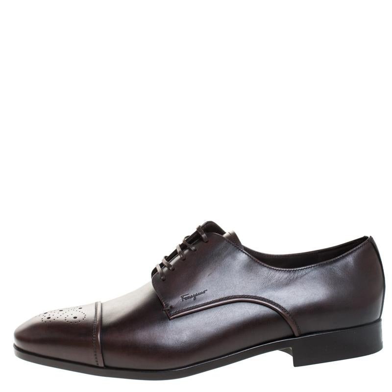 Classy and very stylish, these brown derby shoes from Salvatore Ferragamo definitely need to be on your wishlist! They are crafted from leather and feature brogue-detailed cap toes, lace-ups on the vamps and comfortable insoles. Wear them for your