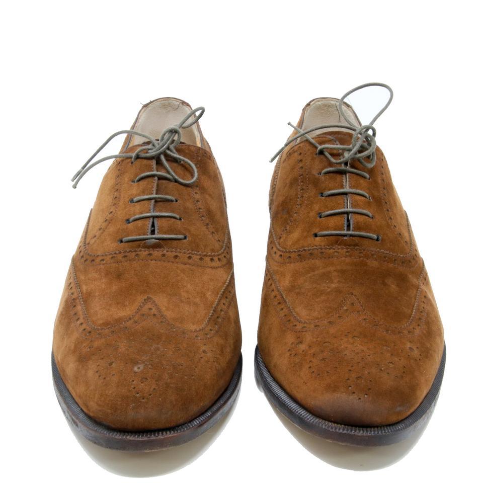 Salvatore Ferragamo Brown Dark Suede Leather Oxford Lace Up Derby Shoes

This Salvatore Ferragamo shoe features suede calfskin leather, detailed stitching and perforations, the upper overlaps and is stitched onto the outsole, and the sole consists