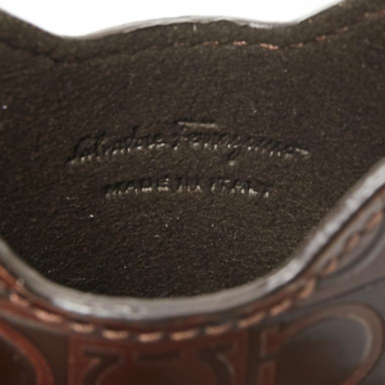 What's not to love about items that are both functional and worthy to be flaunted! This stunning Salvatore Ferragamo cover has been designed smartly to safeguard your phone from any bumps, scratches, and dust. Made from Gancio-embossed leather, the
