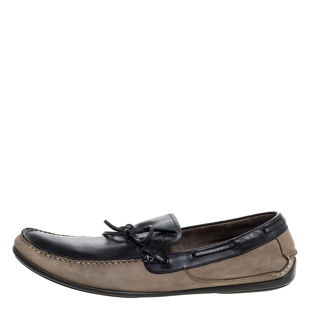 Rock an opulent look by going in for a pair of stylish Salvatore Ferragamo loafers. These brown and grey loafers come crafted from nubuck leather in a slip-on style and feature bows on the vamps. They are equipped with comfortable leather-lined