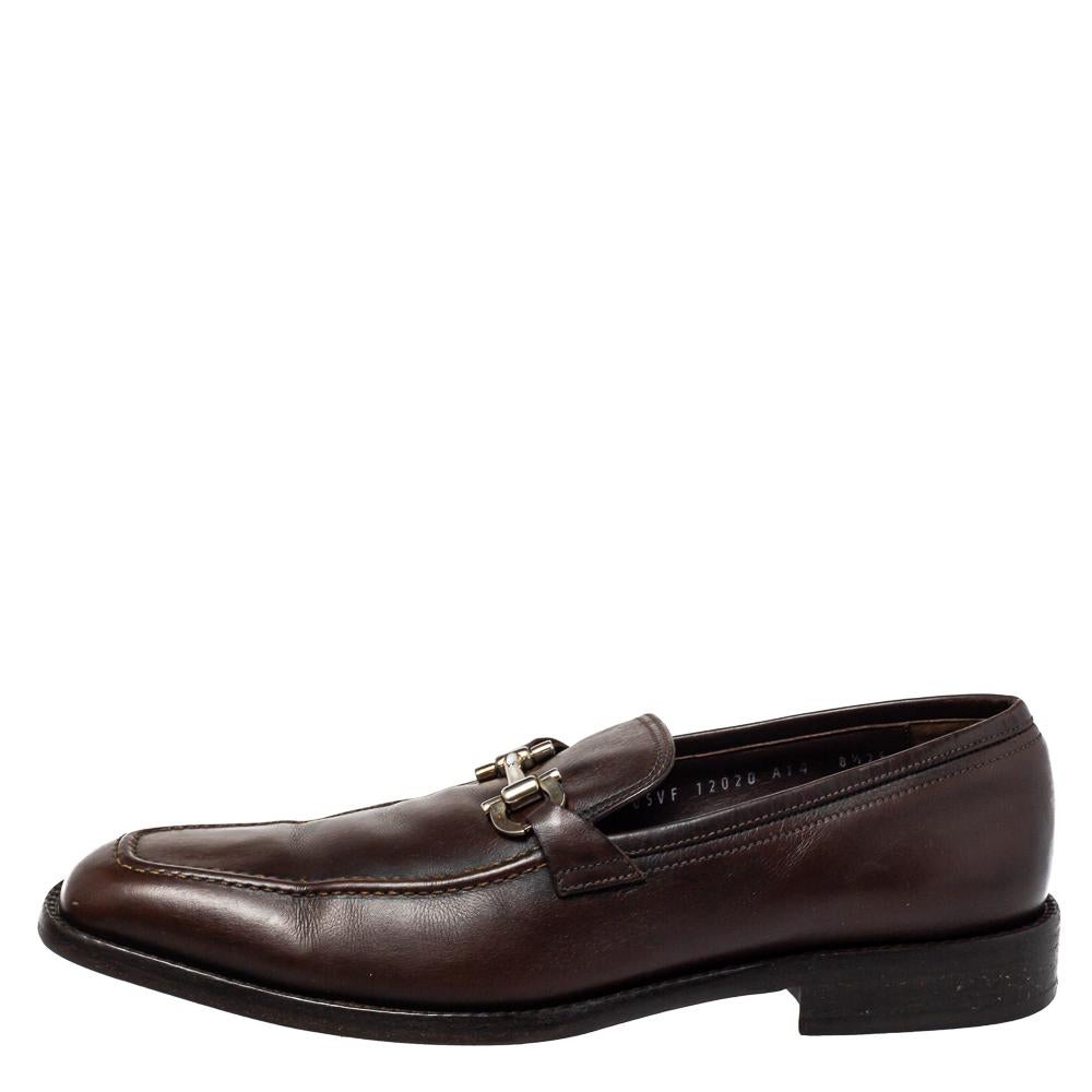 Opt for this pair of smart Salvatore Ferragamo shoes for a luxe look. Crafted in leather, the brown-hued pair of loafers feature Gancini Bit detailing on the uppers and low heels for a comfortable finish.

