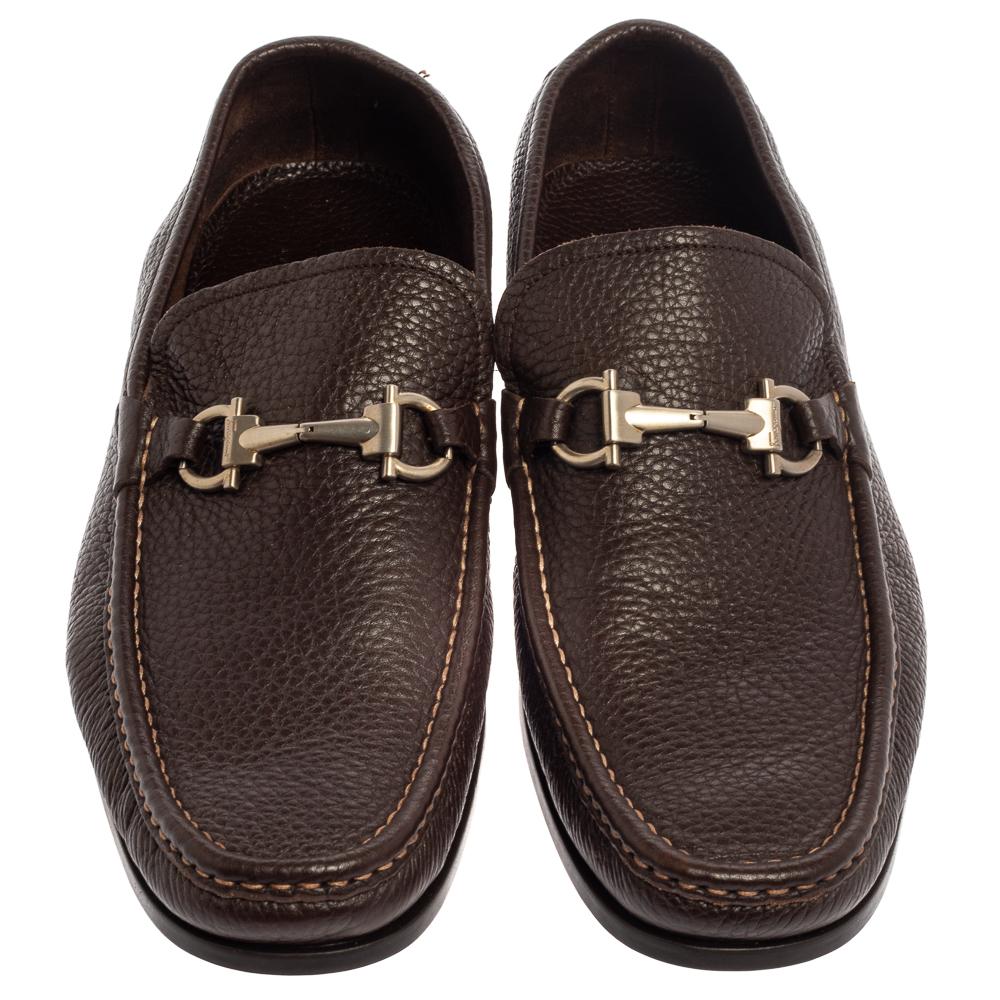 These loafers from Salvatore Ferragamo are not only high on appeal but also very skillfully made. They have been crafted from leather in Italy and designed with beauty using neat stitching and the signature Gancini bit detail on the vamps. The brown