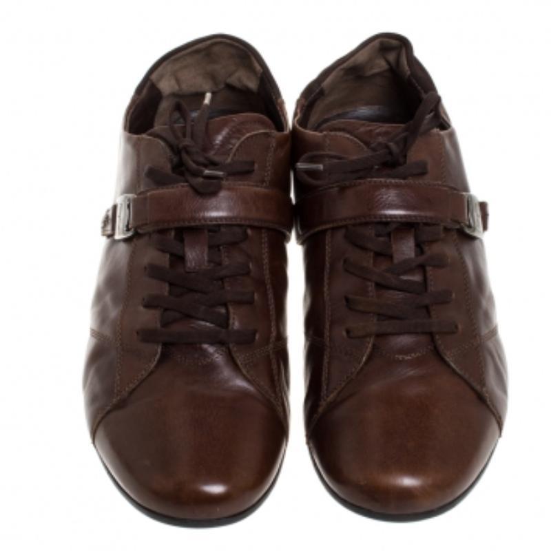 Fashioned to take your style a notch higher, these low top sneakers from Salvatore Ferragamo are absolutely worth the splurge! They've been crafted from leather and styled with a strap across the vamps accompanied by lace-ups and sturdy soles.