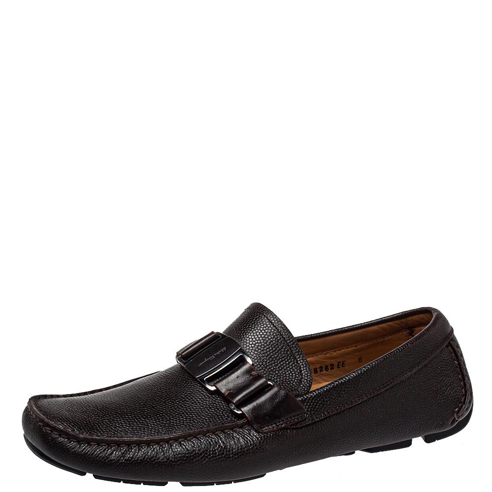 Loafers from Salvatore Ferragamo are simply amazing and these brown ones aptly validate that! They have been crafted from leather and styled with logo detailed silver-tone accents on the vamps. They are complete with comfortable leather insoles and