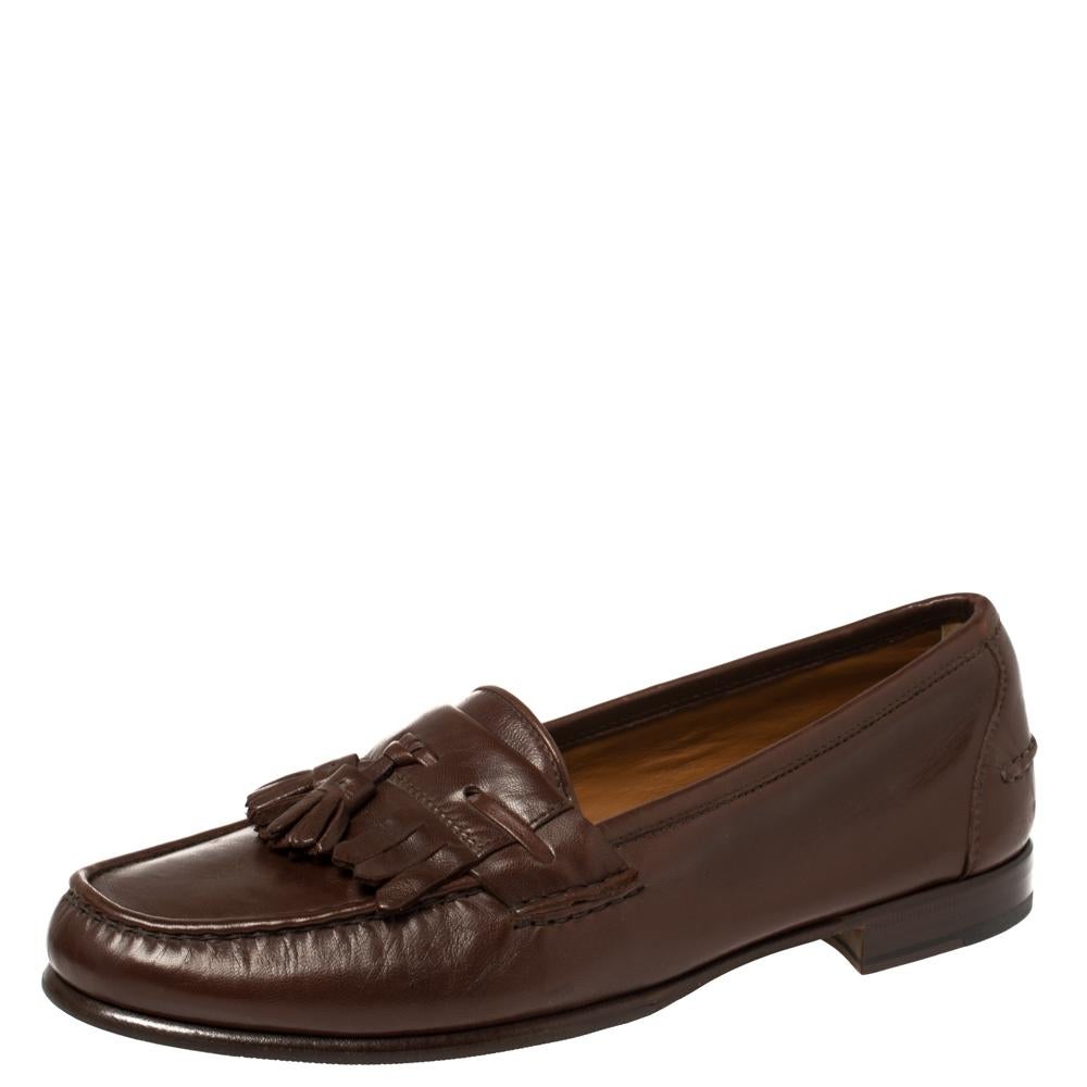 Loafers from Salvatore Ferragamo are simply amazing and these brown ones aptly validate that! They have been crafted from leather and styled with tassels and fringes on the vamps. They are complete with comfortable leather insoles and tough