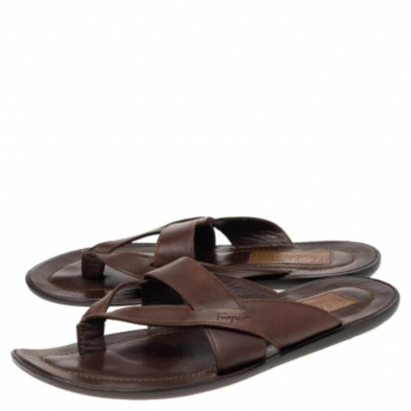 These stylish sandals by Salvatore Ferragamo are great for summer days and will add a luxe touch to any casual outfit. Crafted from leather, they come in a brown hue They are styled in a thong silhouette and have durable soles.