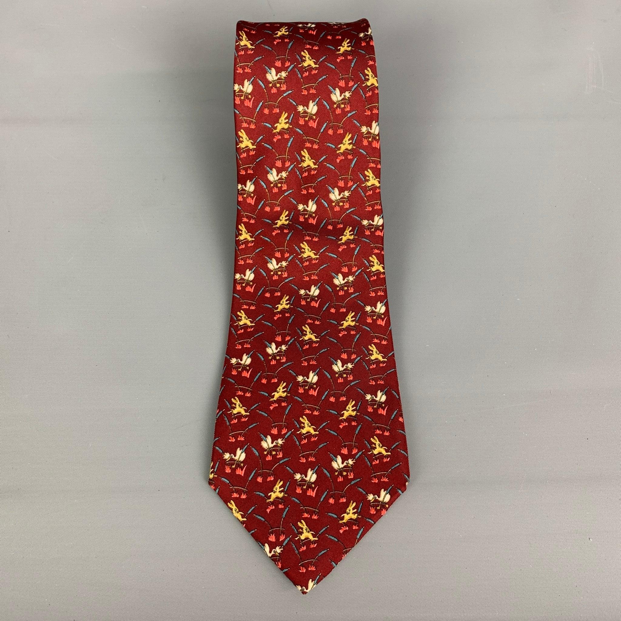 SALVATORE FERRAGAMO necktie comes in burgundy rabbit printed silk material. Made in Italy.Excellent Pre-Owned Condition. Width: 4 inches Length: 60 inches  
 

 

  
  
  
 Sui Generis Reference: 119634
 Category: Tie
 More Details
  
 Brand: