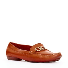 SALVATORE FERRAGAMO burnt orange leather gold logo buckle loafers 6.5