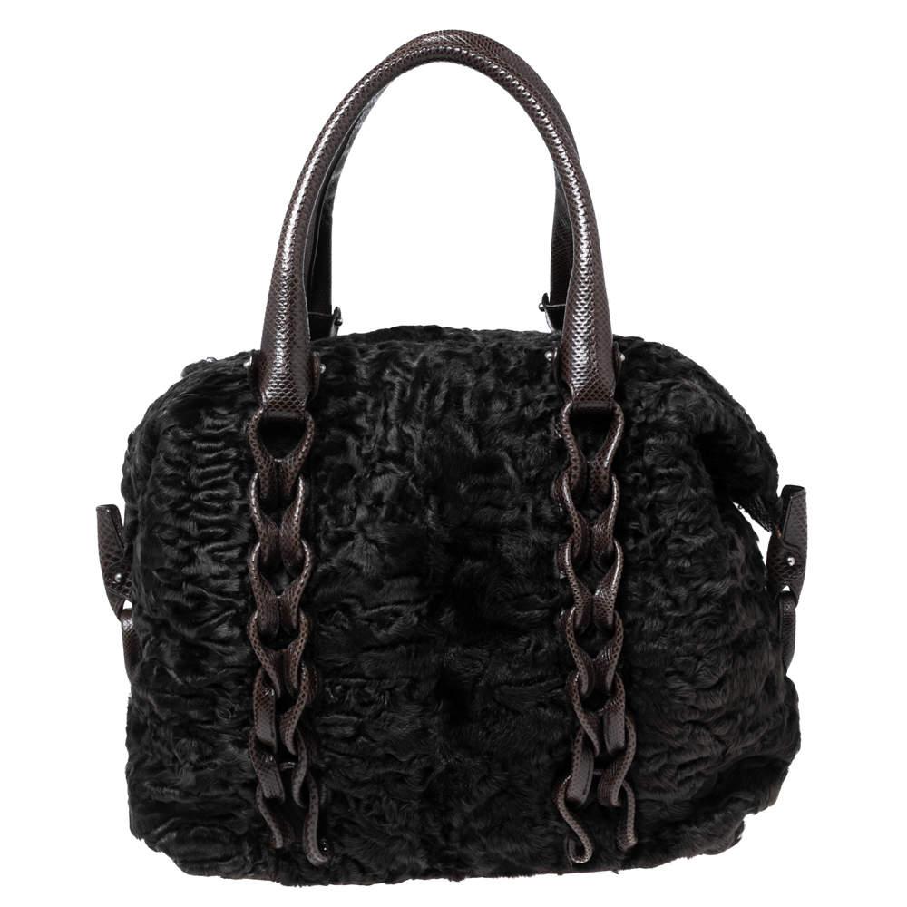 Fur and karung leather have been used to create this Salvatore Ferragamo beauty. It is an eye-catching accessory that's easy to carry. It has a lined interior, two shoulder handles, and silver-tone hardware.


