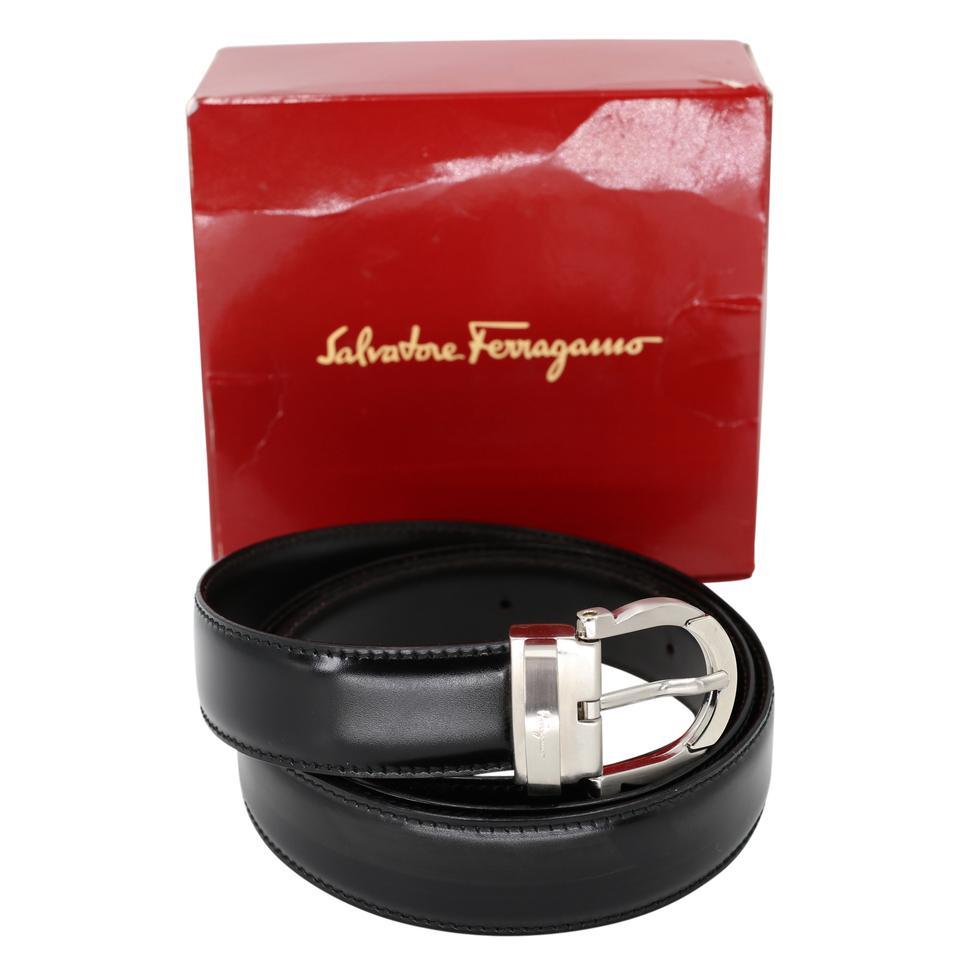 Here is a beautiful Salvatore Ferragamo belt with elegant chrome detail the belt is a classy style with signature omega logo buckle design. The belt includes a 5 hole adjustment and measures 46 inches long. The belt has been used for weeding and