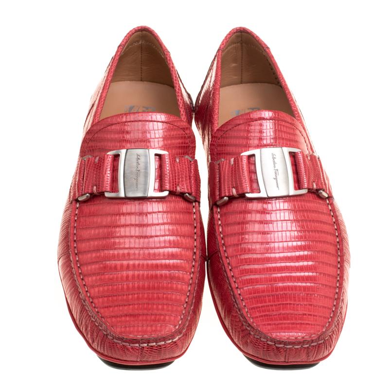 These Sardegna loafers from Salvatore Ferragamo are absolutely drool worthy. The coral red loafers are crafted from lizard leather and feature an engraved brand name silver-tone buckle detailing. They come equipped with comfortable leather lined