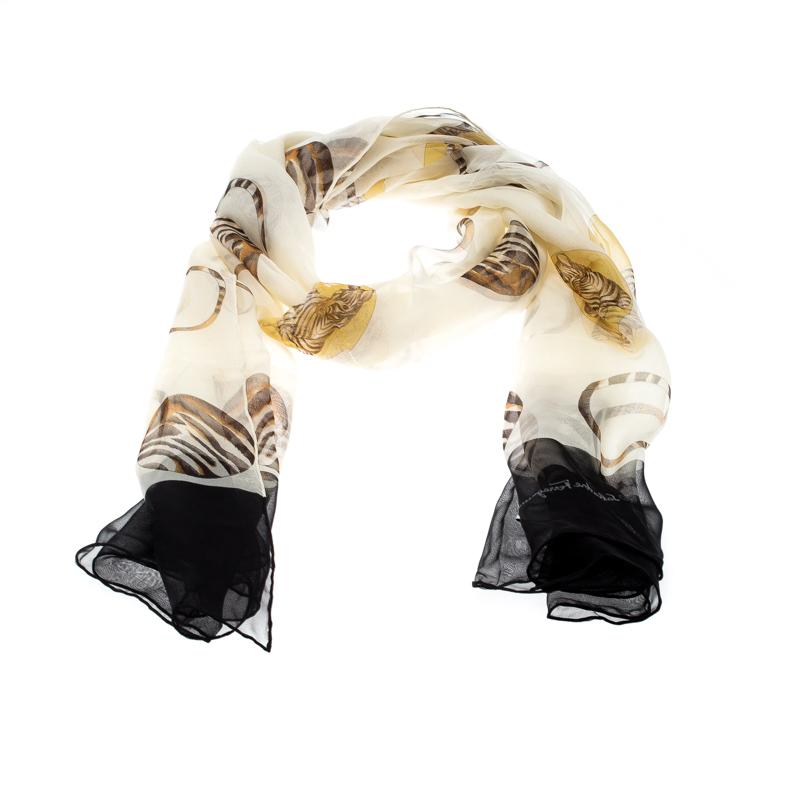 You are bound to impress onlookers with this scarf from Salvatore Ferragamo. Luxuriously cut from silk in Italy, the scarf has a gorgeous print all over its expanse, and every accent on the piece speaks royalty. The scarf is complete with the brand