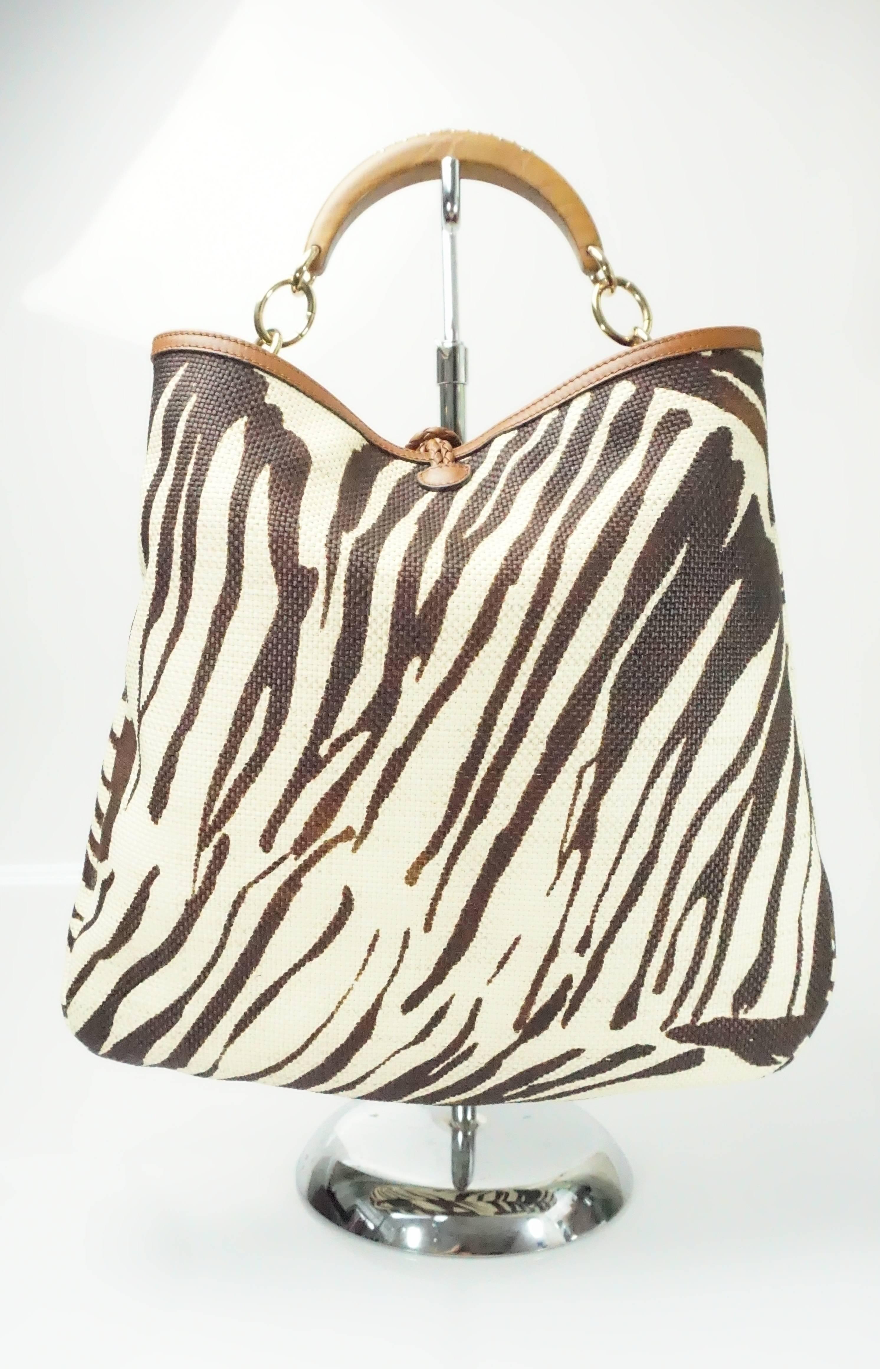 Salvatore Ferragamo Earthtone Zebra Print Rafia Handbag w/ Wood Studded Handle.  This beautiful bag has a brown zebra print design, a short wooden handle with embossed logo and stud details. There is a gold toned metal chain detailing to the handle