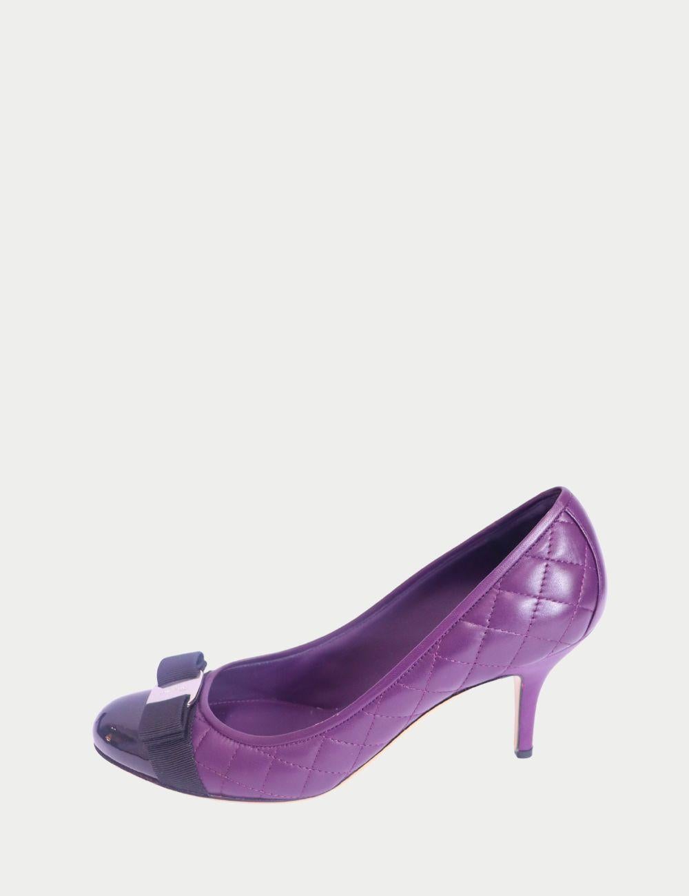 Salvatore Ferragamo Quilted Cap Toe Heels in Purple with Bow Detail

Classic sophistication gets a bold twist with these Salvatore Ferragamo quilted heels in deep purple. Designed in soft leather with an elegant quilted finish, these mid-height