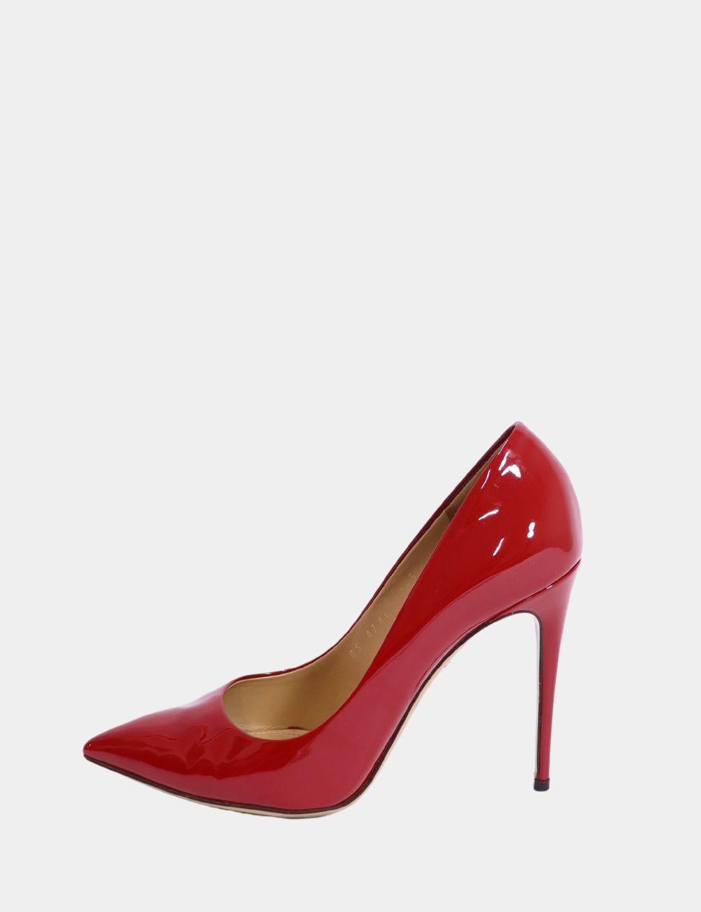Make a bold and timeless statement with these Salvatore Ferragamo Red Patent Leather Pumps. Featuring a sleek pointed toe and elegant stiletto heel, these pumps are crafted from glossy red patent leather that instantly elevates any look. Perfect for