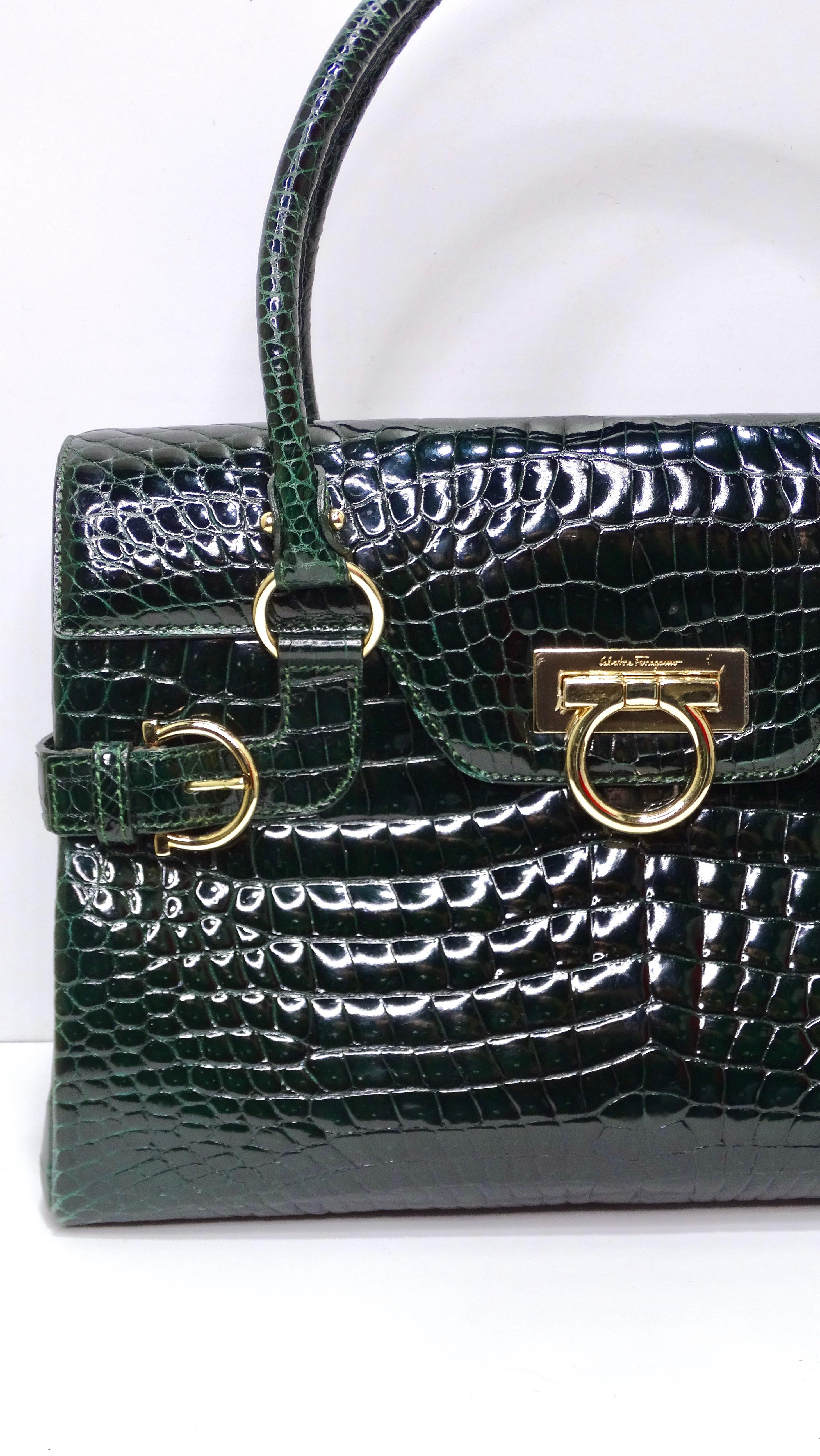 The vintage find of the century! Do not pass this up! This is a beautiful and authentic Salvatore Ferragamo flap top-handle bag in real green alligator in a medium size. This embodies a ladylike sophistication perfect for the chic fashionista that
