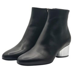 Salvatore Ferragamo - Bottines en cuir en noir