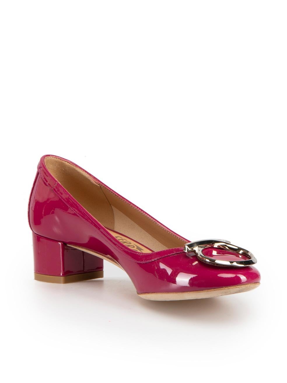 CONDITION is Very good. Hardly any visible wear to shoes is evident on this used Salvatore Ferragamo designer resale item. These shoes come with original box and dust bag.
 
 Details
 Gancini
 Fuchsia
 Patent leather
 Pumps
 Mid heel
 Slip on
