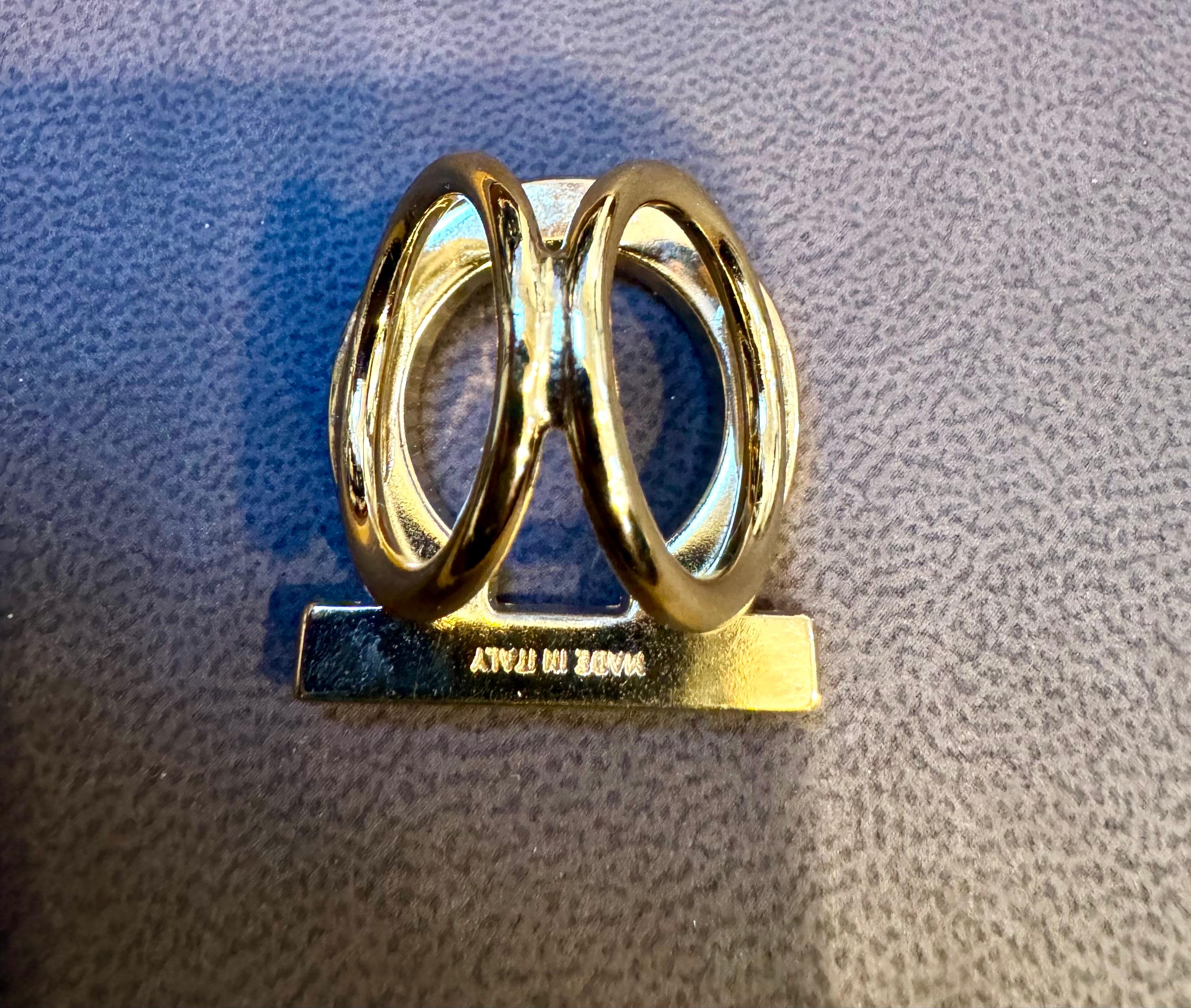 Salvatore Ferragamo Gold Tone authentic scarf ring with designer engraved signature at back 
Scarf Ring
Length 1.2 