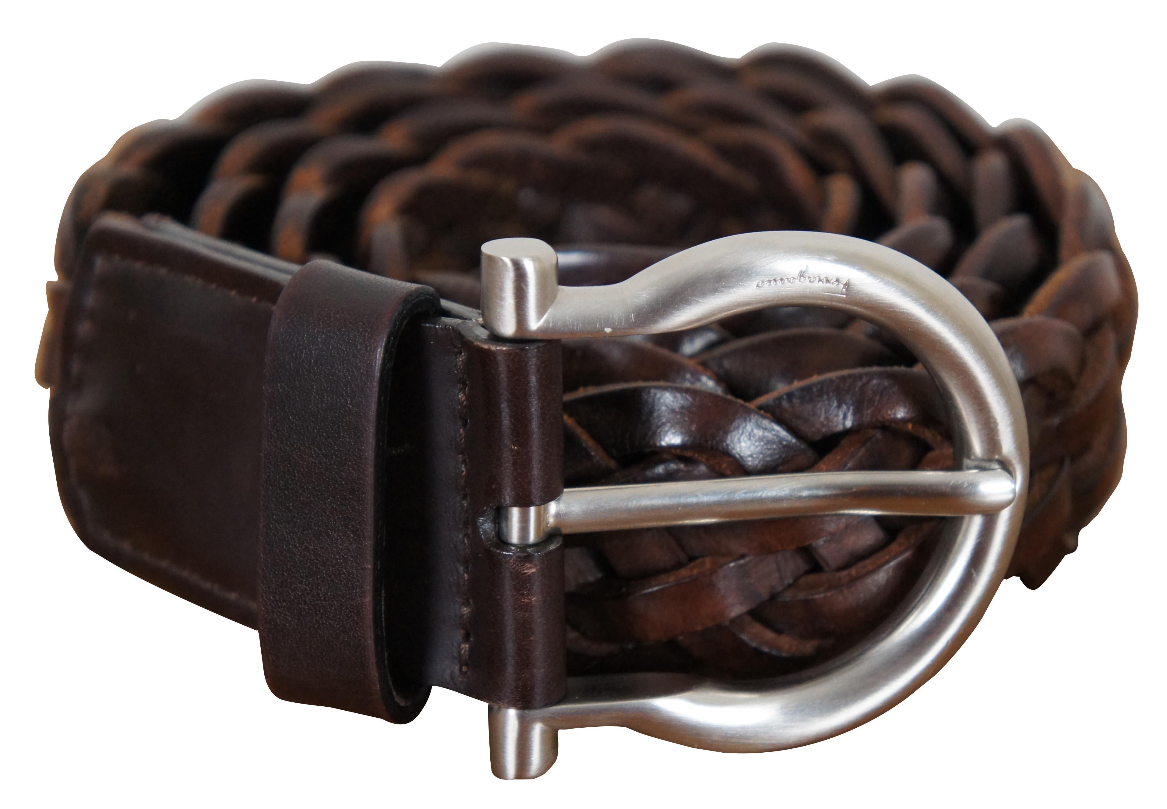 Salvatore Ferragamo brown leather woven / braided belt with Gancini horseshoe shaped silver toned buckle.

Size 40 / Total Length – 47.5” x 1.5” / Buckle - 2.25” x 2.375” (Length x Width).