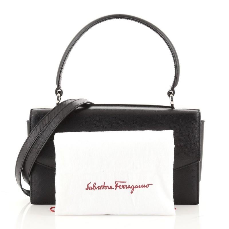 Condition: Very good. Slight creasing, minor wear and scuffs on exterior, handle and underneath flap, small glue stains on opening corners. Moderate wear on flap opening corner, scratches on hardware.
Accessories: Dust Bag, With Strap
Measurements:
