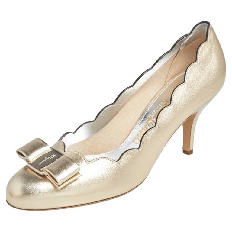 Salvatore Ferragamo Gold Leather Carla Vara Bow Pump Size 37 For Sale at  1stDibs