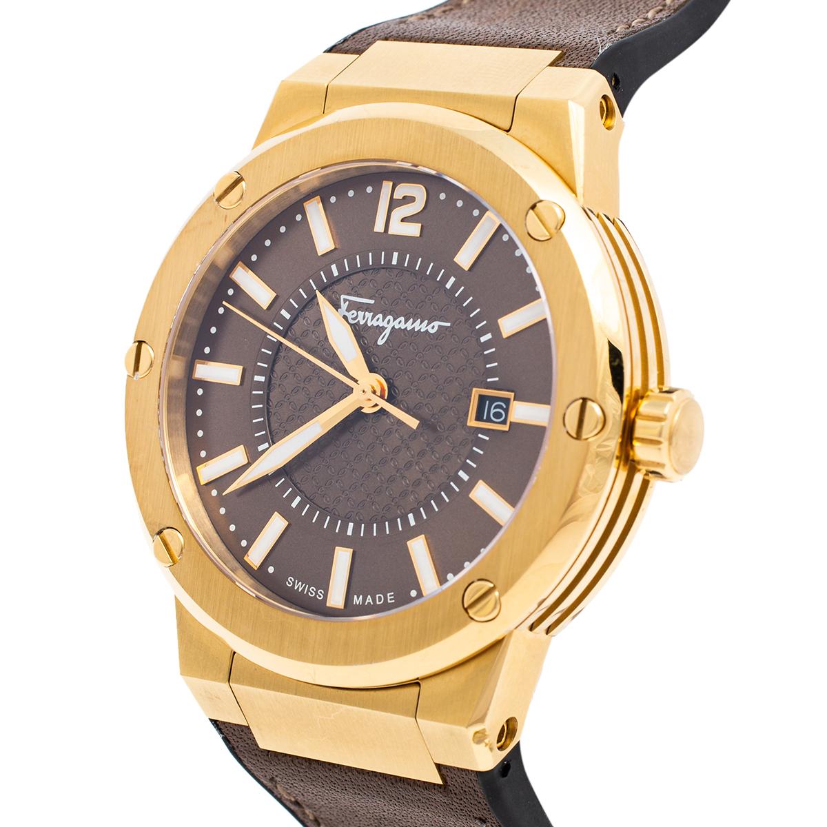 Let this Salvatore Ferragamo watch keep you on time and add to your everyday style. The gold stainless steel case comes with a brown dial featuring elegant markers, three hands, and a date window at the 3 o'clock position. It is complete with a