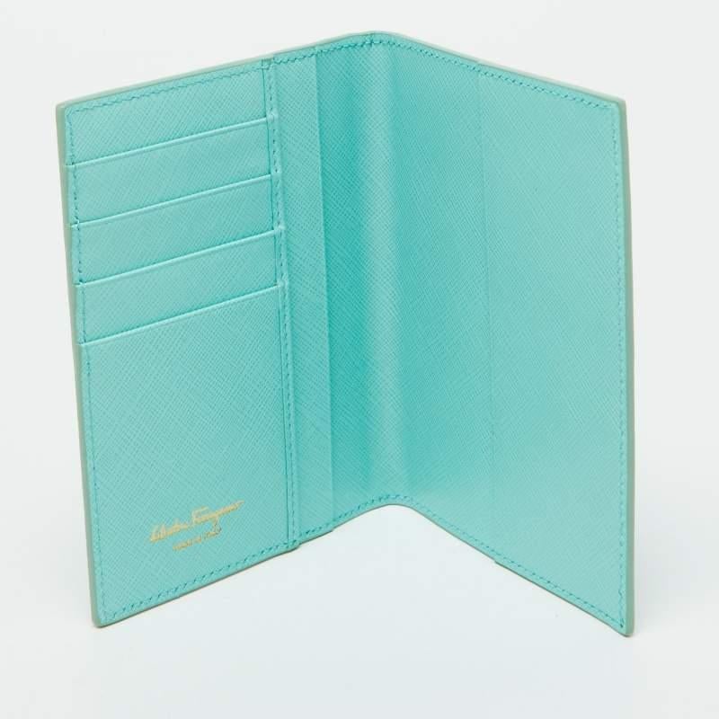 Salvatore Ferragamos passport holder comes in a practical yet classy design. The exterior is made from green leather with tonal stitching. Perfect in size it can easily fit inside your travel bag.