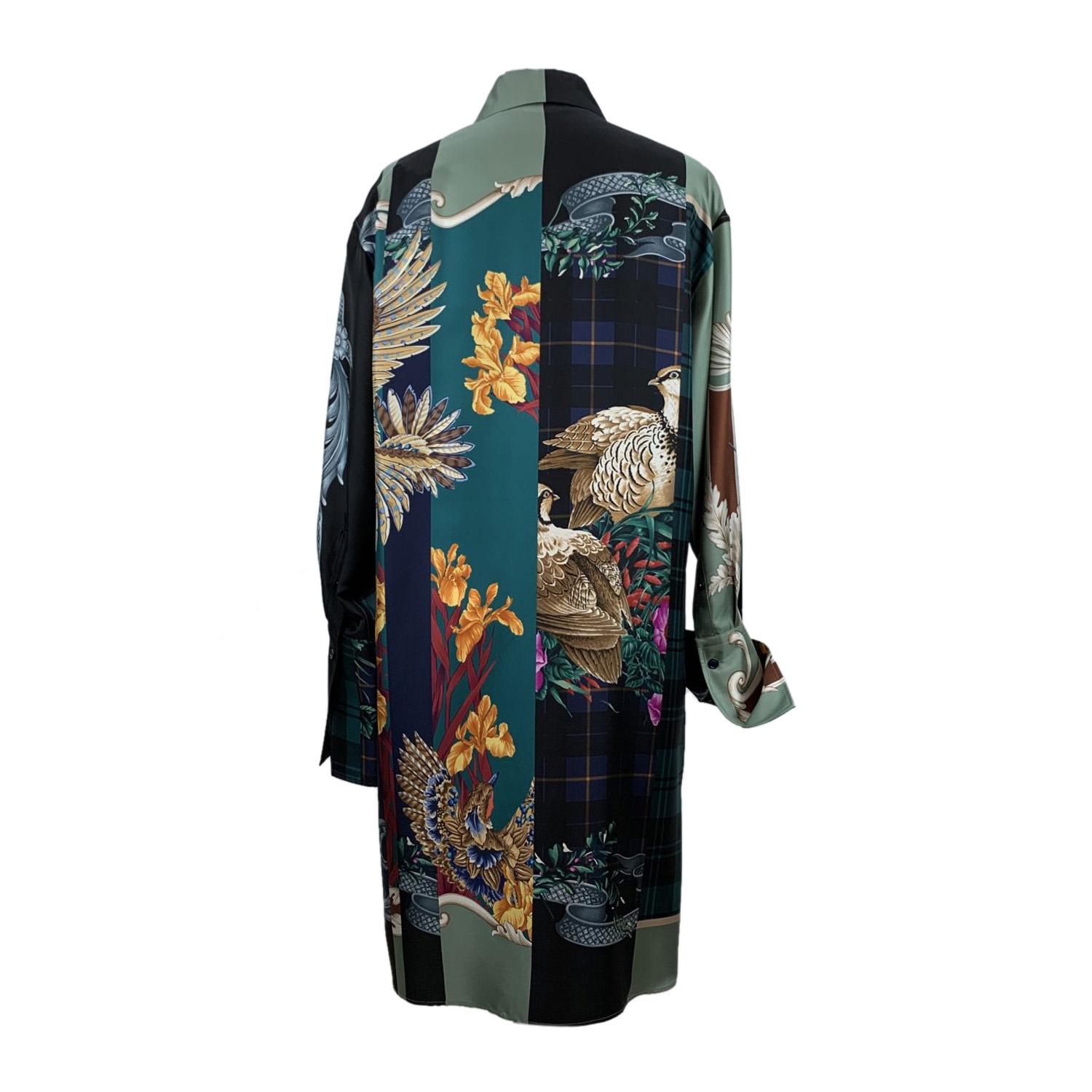 Salvatore Ferragamo multicolor patchwork printed long-line shirt. Pointed collar. Long sleeve styling with buttoned cuffs. Button placket. Side slits. Composition: 100% silk. Can also be used as a dress. Size: 38 IT (The size shown for this item is