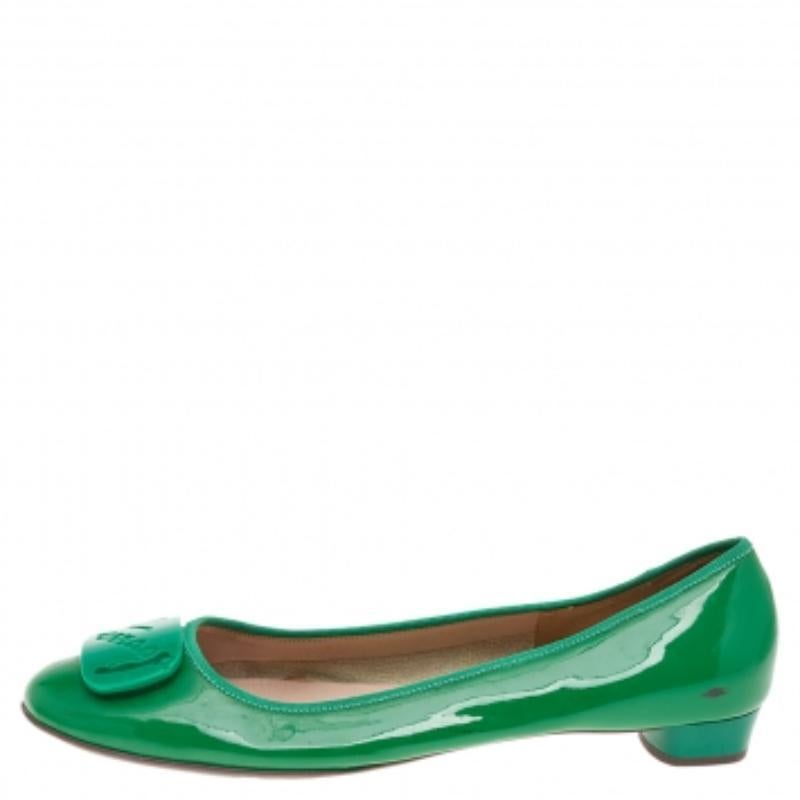 When comfort meets style, we get these well-designed ballet flats by Salvatore Ferragamo. Made using green patent leather, they feature round toes embellished with a buckle and leather-lined insoles for all-day ease.