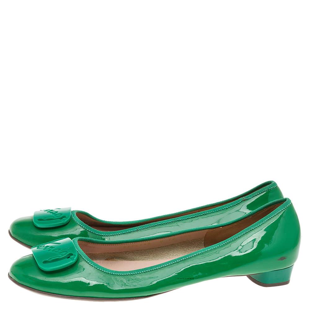 When comfort meets style, we get these well-designed ballet flats by Salvatore Ferragamo. Made using green patent leather, they feature round toes embellished with a buckle and leather-lined insoles for all-day ease.

