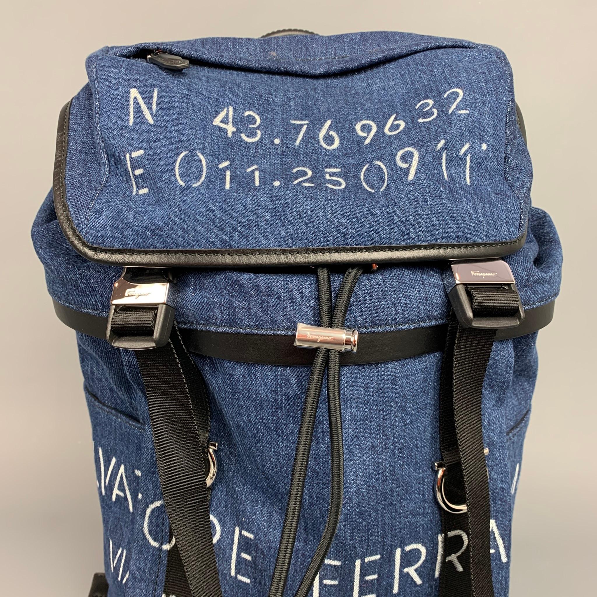SALVATORE FERRAGAMO backpack comes in a indigo denim with logo print details featuring leather trim details, inner zipper pockets, padded mesh panels at back, signature gancini hardware on straps, and front buckle closures. Comes with dust bag. Made