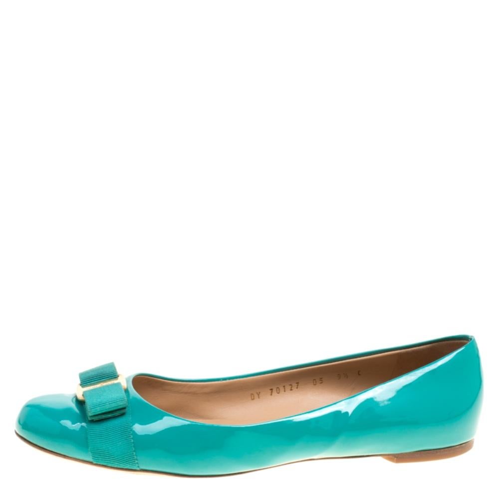Fashion is the perfect blend of luxury with comfort, and this pair of ballet flats from the house of Ferragamo exudes just that. Crafted from jade green patent leather and styled with their signature Varina bow on the uppers, these flats are ideal