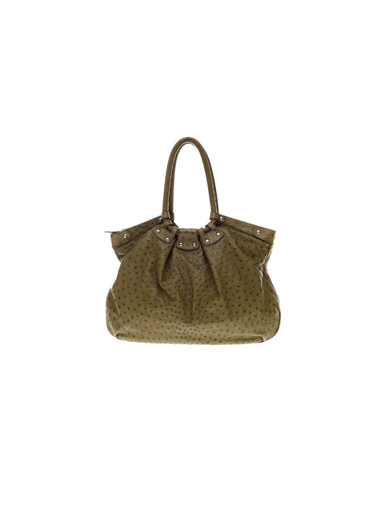 Stunning Real Ostrich Skin Shoulder Bag by Salvatore Ferragamo - a timeless classic!

Made of finest ostrich skin
Olive green color
Fully lined with chocolate brown suede leather
One inner bag with zip closure, three open inner bags for phone
