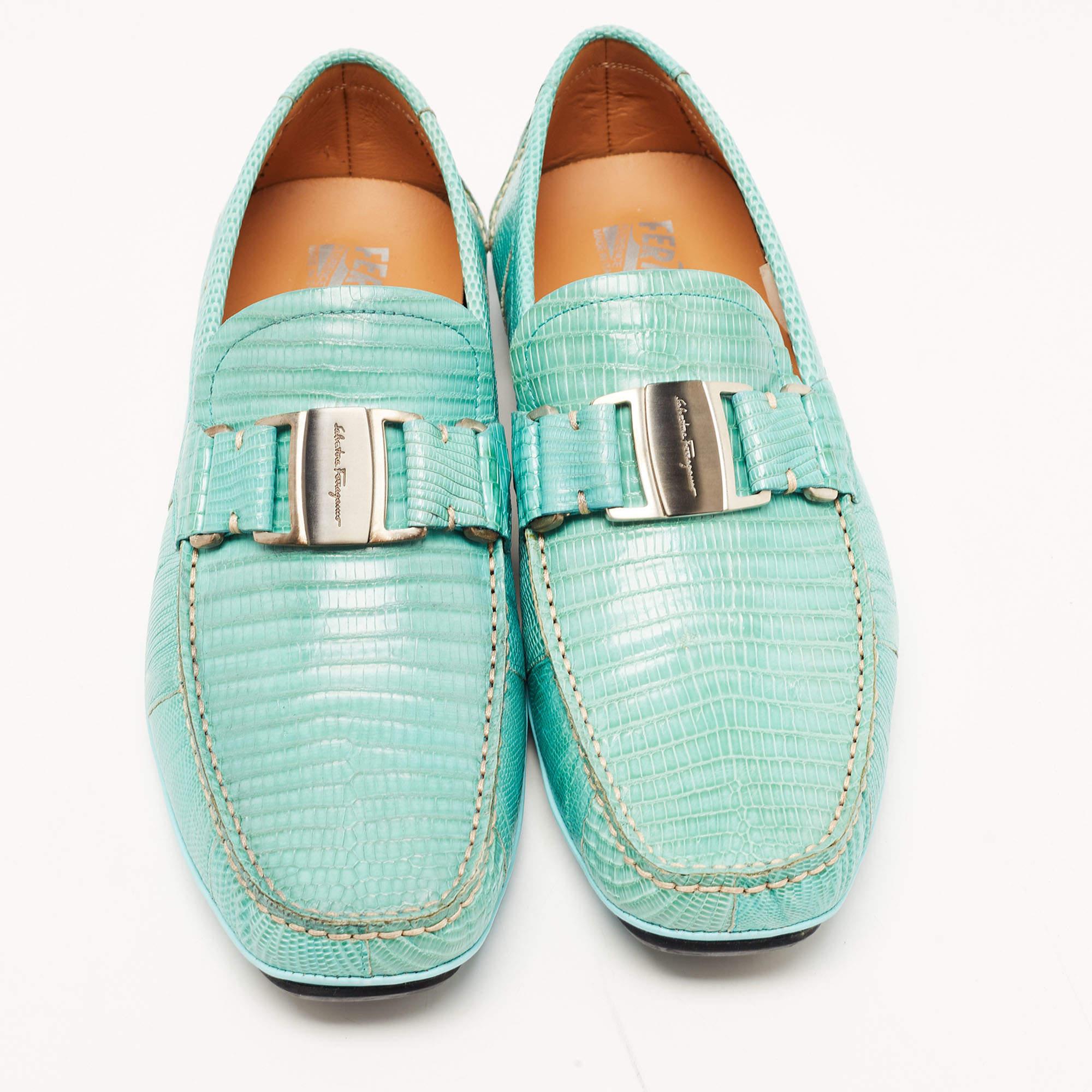 Created using exotic lizard leather, these Sardegna loafers from Salvatore Ferragamo lend a unique aspect to your footwear collection. The loafers have a light blue shade on their exterior, with silver-toned accents decorating the vamps. Embrace a