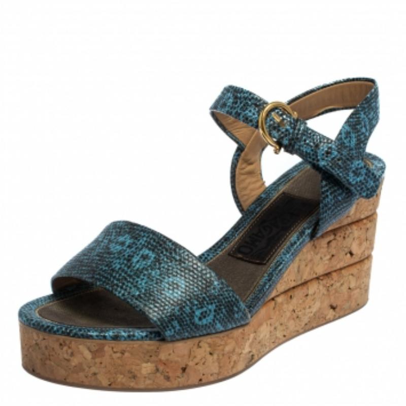 Add oodles of style to your footwear collection with these sandals from Salvatore Ferragamo. These sandals exude classic Italian charm with their stunning lizard-embossed leather straps in a slingback design with buckle closure. They feature stacked