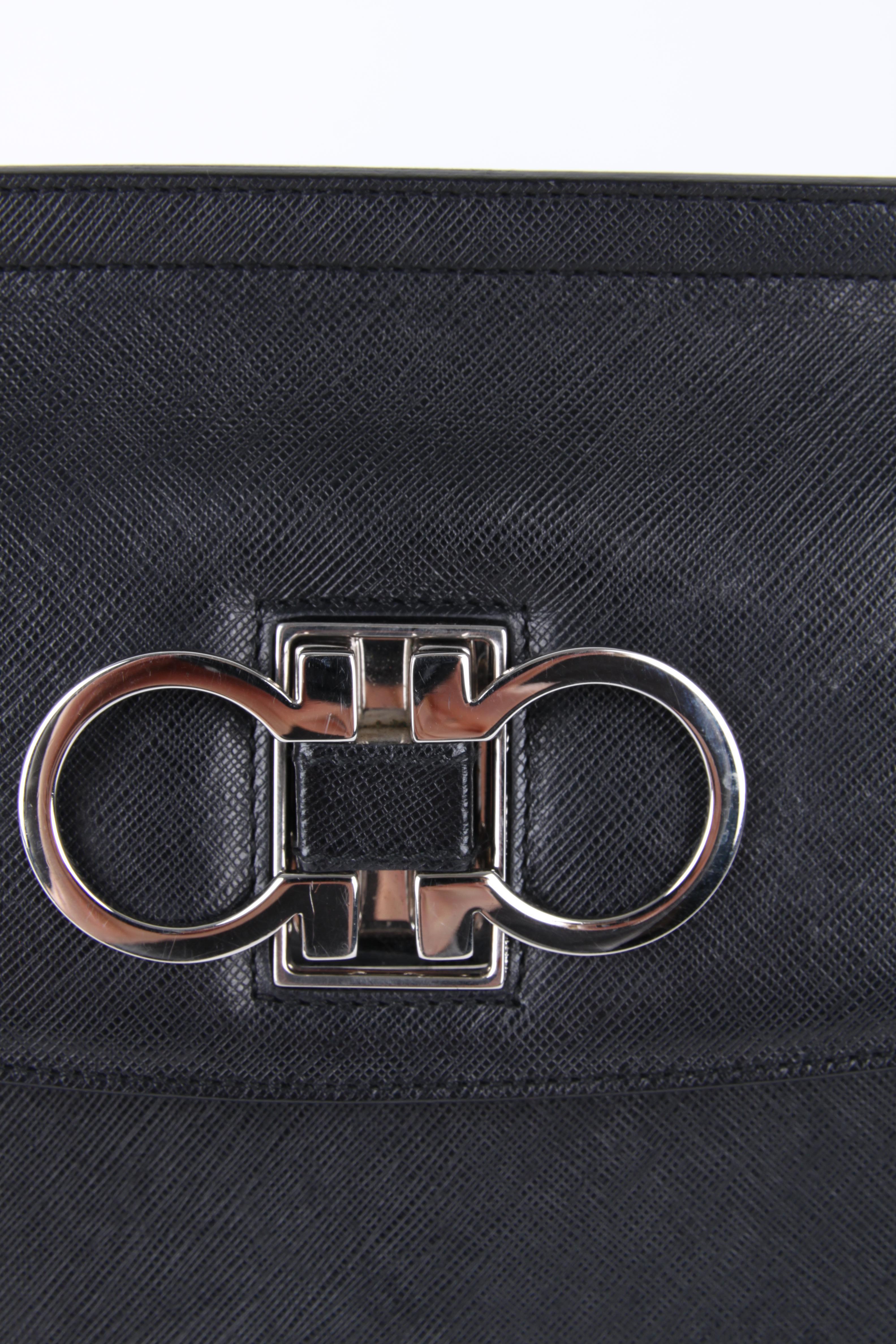 Black   Salvatore Ferragamo Logo Plaque Leather Clutch Handbag    For Sale
