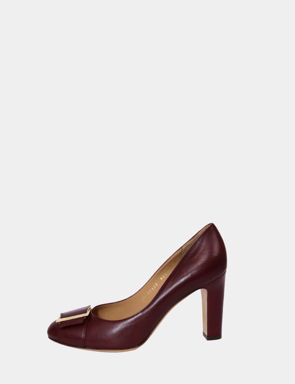Classic sophistication meets timeless Italian design in these Salvatore Ferragamo Burgundy Leather Pumps. Featuring the iconic Vara bow adorned with gold-tone hardware, these pumps are crafted in luxurious smooth leather with a flattering round toe