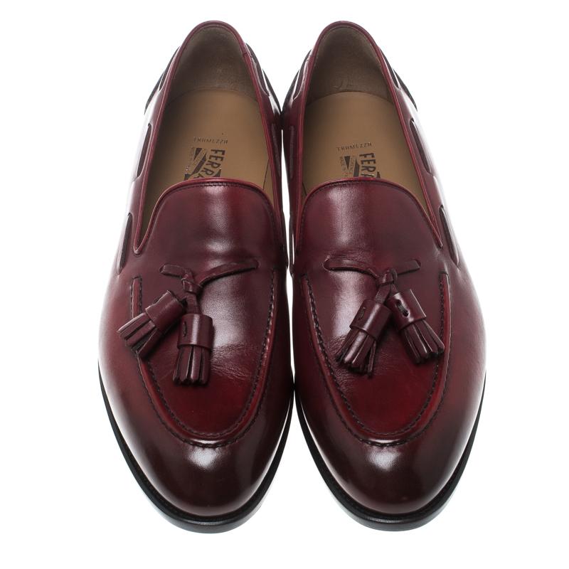 Salvatore Ferragamo brings you these exquisite loafers that have been created with luxury in mind. They are covered in maroon leather and detailed with tassels on the uppers and leather insoles meant to offer comfort in every step. The loafers are a