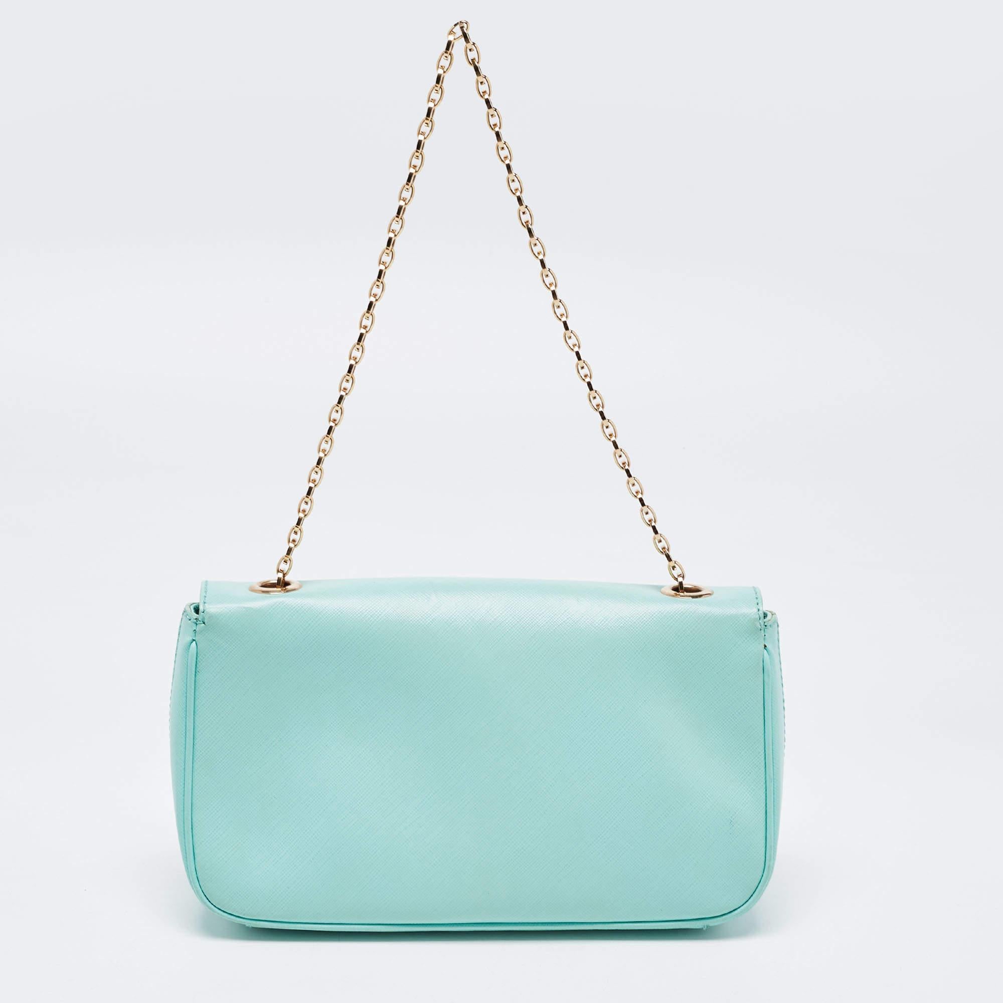 Cool, Trendy, Aesthetic and Adorable. This Mint Green Flap bag from the house of Salvatore Ferragamo cues in spark to your attitude. It rightly adds flame to your looks and panache. The elegance of this Gancini Leather product is exquisite and peps