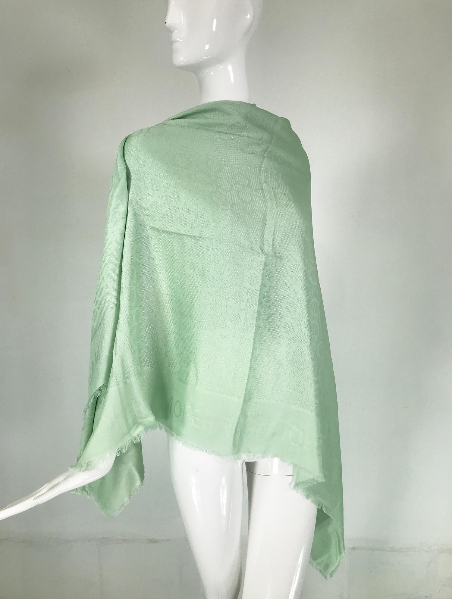 Salvatore Ferragamo mint green silk & wool jacquard shawl with self fringe. A beautiful shawl with a jacquard woven Ferragamo logo design.