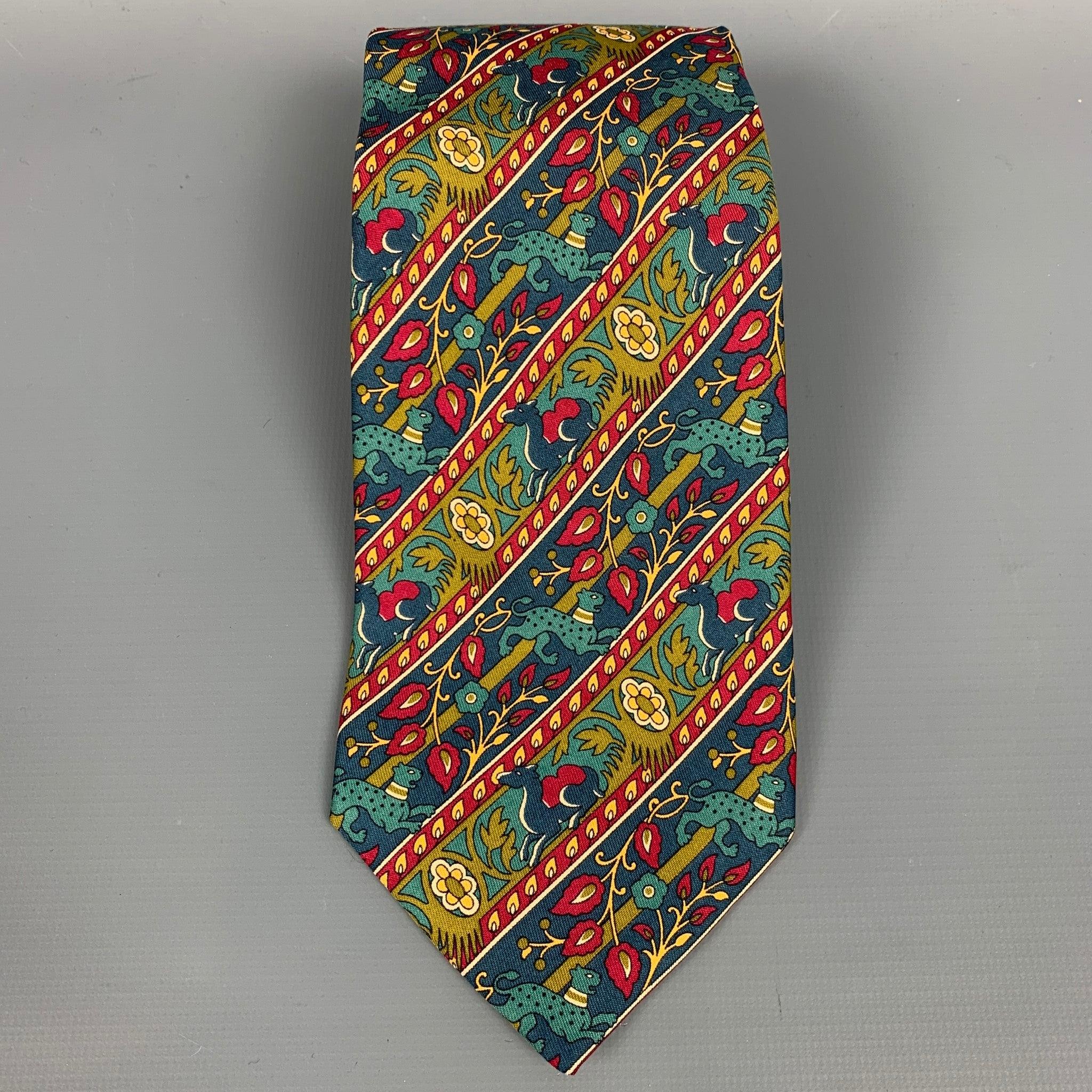 SALVATORE FERRAGAMO neck tie comes in a multi-color tapestry silk. Made in Italy.Very Good Pre-Owned Condition. 

Measurements: 
  Width: 3.5 inches  
  
  
 
Reference: 108179
Category: Tie
More Details
    
Brand:  SALVATORE FERRAGAMO
Color: 