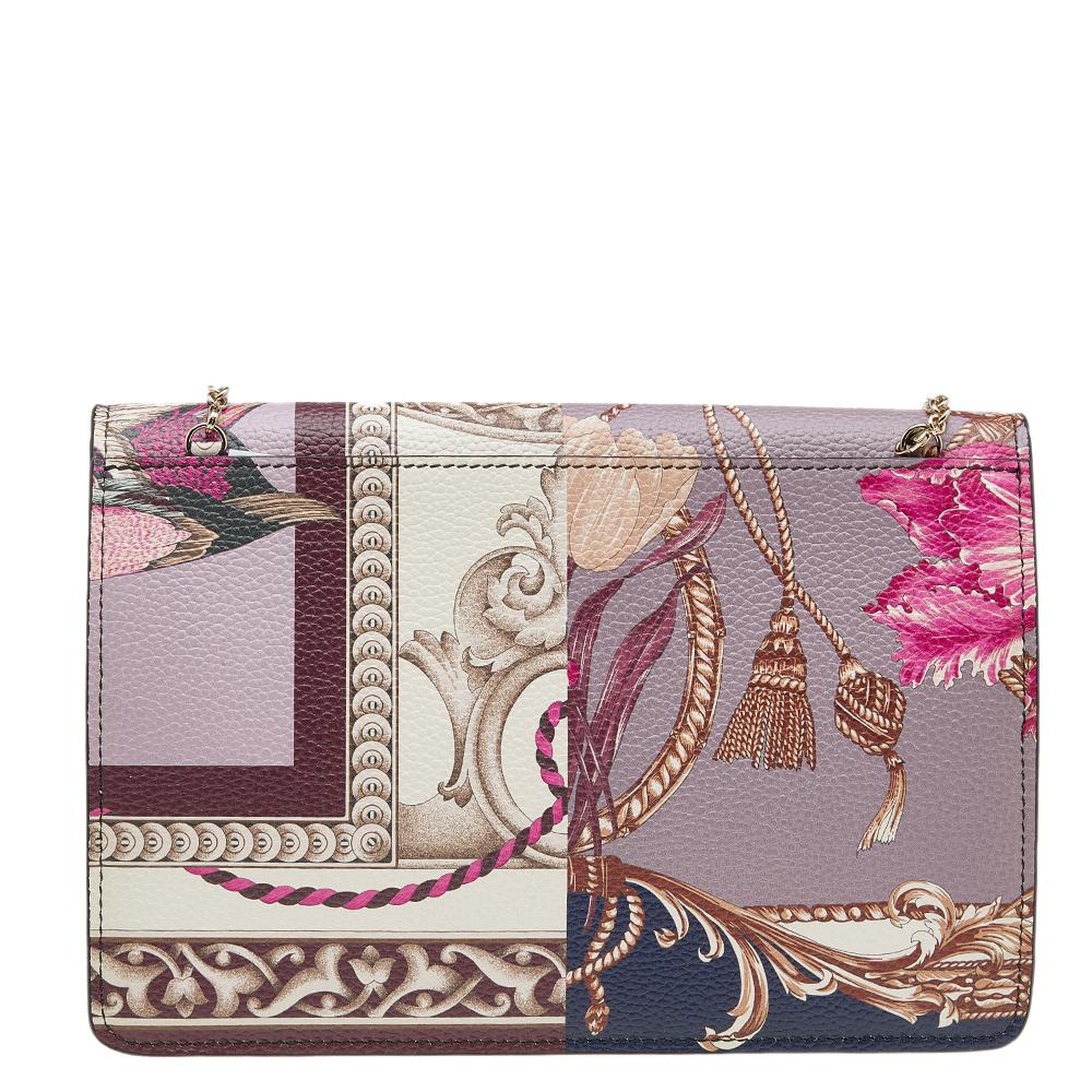 The prints covering the exterior make this Salvatore Ferragamo bag a visual treat. It is sewn using leather and added with a chain handle and a well-sized interior.

Includes: Info Booklet
