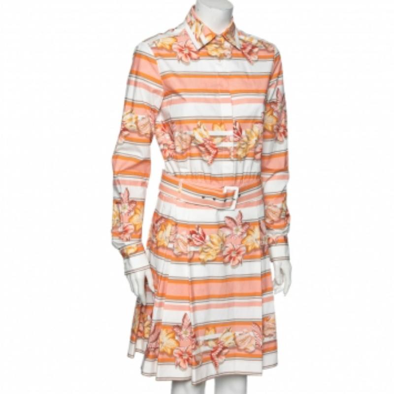 Este vestido camisero de la Casa Salvatore Ferragamo se convertirá en tu favorito enseguida. Está confeccionado en tejido de algodón estampado multicolor y luce mangas largas, detalle de cinturón y cuello. Tiene cierres abotonados. Este vestido de