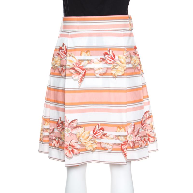 Step out in style this season with this lovely skirt from Salvatore Ferragamo. Tailored from cotton, this printed skirt has a belted waistline and is designed with pleats which gives it a great shape. You can team this piece with a solid top and