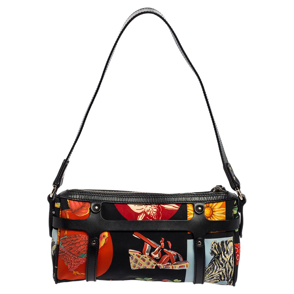 Stunning to look at and durable enough to accompany you wherever you go, this Salvatore Ferragamo satchel will be a delight to own! This bag is crafted from nylon fabric bursting with colourful prints, and it has a flat handle, leather straps in a