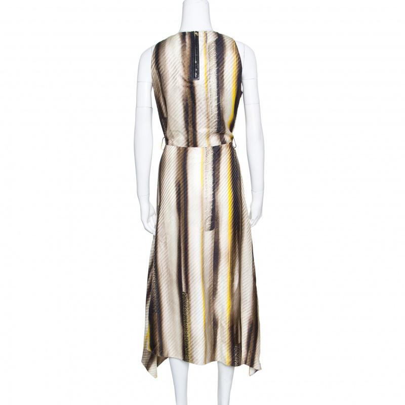 Ditch those regular and boring dresses and get your hands on this fabulous one from Salvatore Ferragamo. The dress is made of 100% rayon and features a multicolour rinted pattern all over it. It flaunts an asymmetrical silhouette, a round neckline